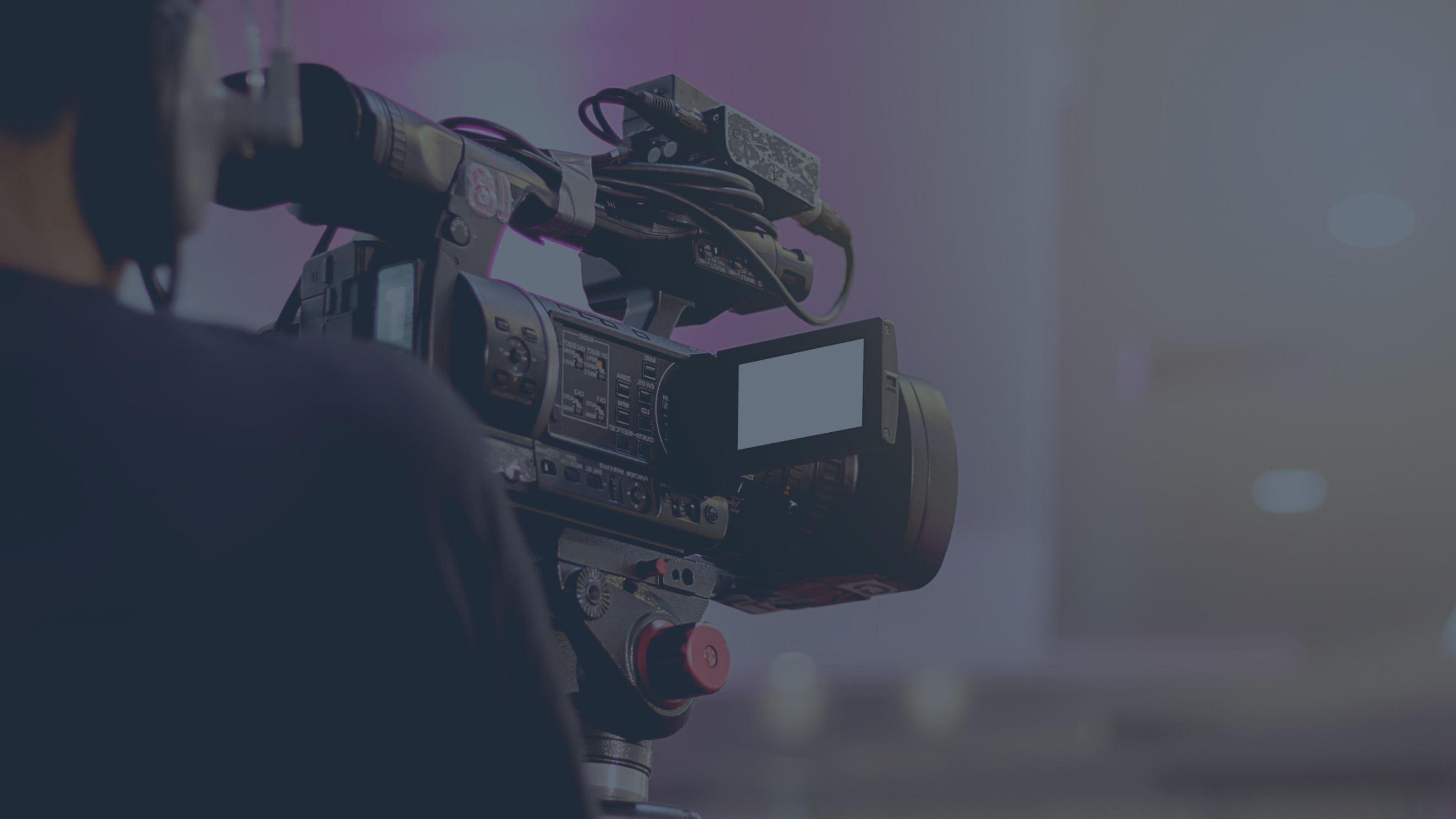 Man holding a video camera from our video and animation agency